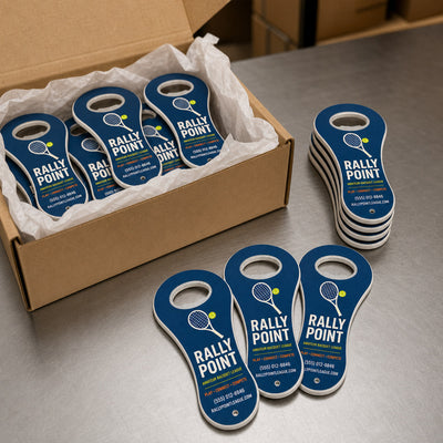 Amateur Sports League custom logo bottle opener magnet - bulk order laid out before packing