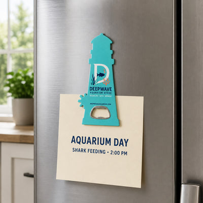 Aquarium Gift Shop custom logo bottle opener magnet - held on a refrigerator door by its magnetic back