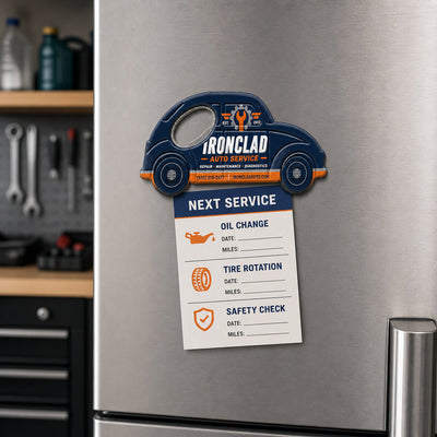 Auto Repair Shop custom logo bottle opener magnet - held on a refrigerator door by its magnetic back