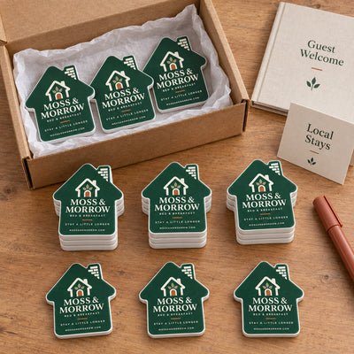 Bed and Breakfast custom logo bottle opener magnet - bulk order laid out before packing