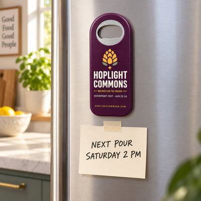 Beer Festival custom logo bottle opener magnet - held on a refrigerator door by its magnetic back