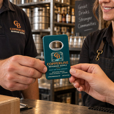 Beverage Distributor custom logo bottle opener magnet - handed to a customer