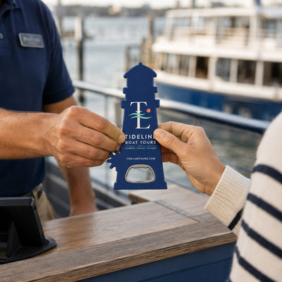 Boat Tour custom logo bottle opener magnet - handed to a customer