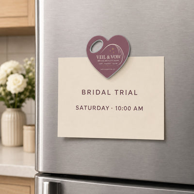 Bridal Beauty Team custom logo bottle opener magnet - held on a refrigerator door by its magnetic back