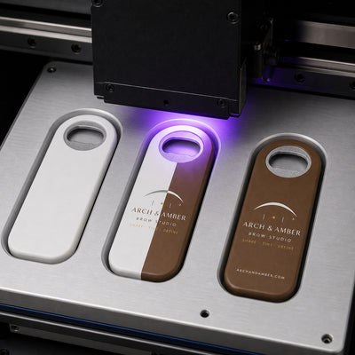 Brow Studio custom logo bottle opener magnet - close-up of the UV printed logo