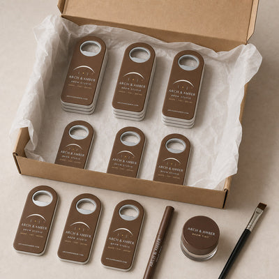 Brow Studio custom logo bottle opener magnet - bulk order laid out before packing