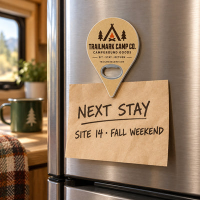 Campground Souvenir custom logo bottle opener magnet - held on a refrigerator door by its magnetic back