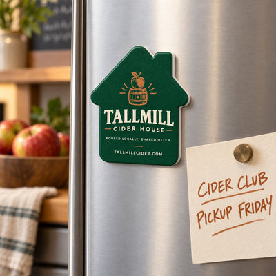 Cider House custom logo bottle opener magnet - held on a refrigerator door by its magnetic back