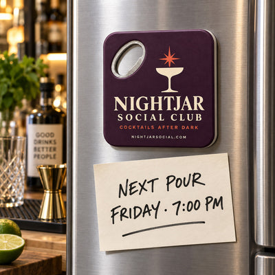 Cocktail Bar custom logo bottle opener magnet - held on a refrigerator door by its magnetic back