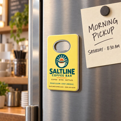 Coffee Shop custom logo bottle opener magnet - held on a refrigerator door by its magnetic back