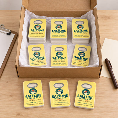 Coffee Shop custom logo bottle opener magnet - bulk order laid out before packing