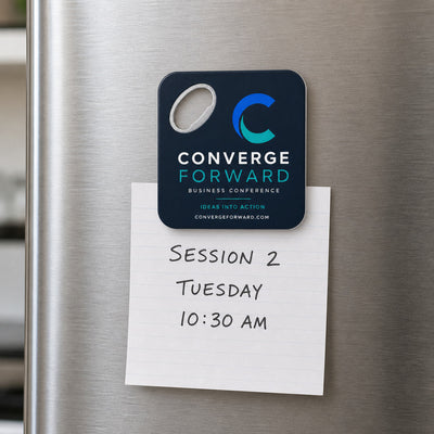 Conference Branded custom logo bottle opener magnet - held on a refrigerator door by its magnetic back