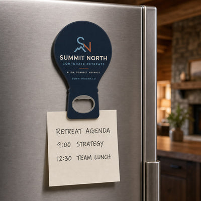 Corporate Retreat custom logo bottle opener magnet - held on a refrigerator door by its magnetic back