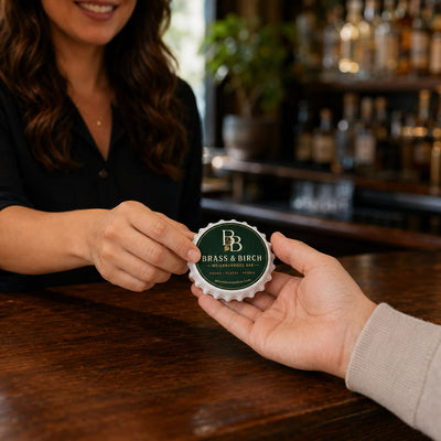 Custom Bar Logo custom logo bottle opener magnet - handed to a customer