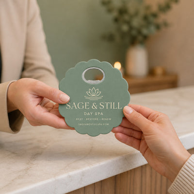Day Spa custom logo bottle opener magnet - handed to a customer