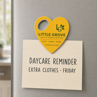 Daycare Center custom logo bottle opener magnet - held on a refrigerator door by its magnetic back