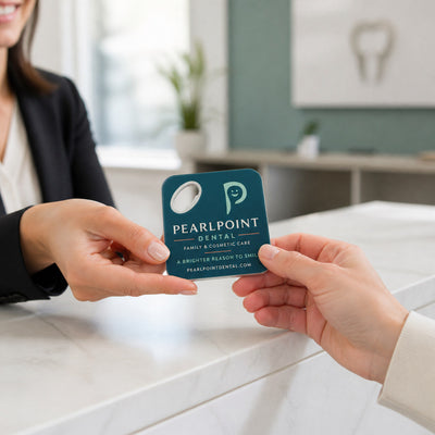 Dental Clinic custom logo bottle opener magnet - handed to a customer
