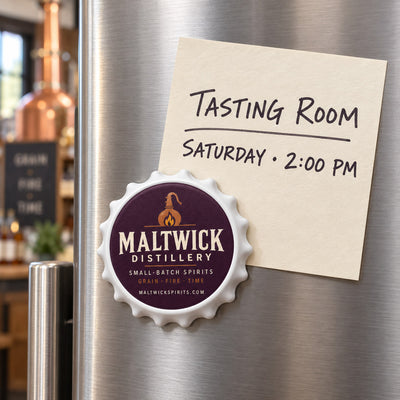 Distillery Logo custom logo bottle opener magnet - held on a refrigerator door by its magnetic back