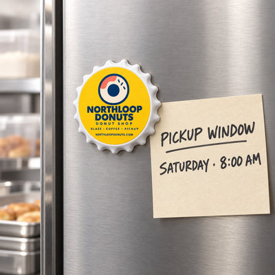 Donut Shop custom logo bottle opener magnet - held on a refrigerator door by its magnetic back