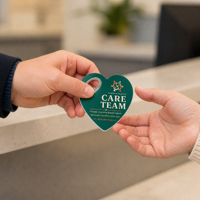 Healthcare Team Appreciation custom logo bottle opener magnet - handed to a customer