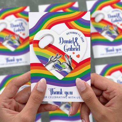 Rainbow Pride Heart wedding bottle opener magnet shown in hand on its printed background card