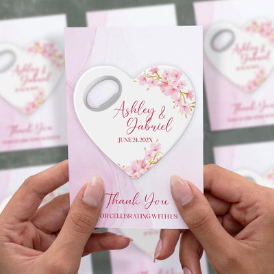 Heart Pink Floral wedding bottle opener magnet shown in hand on its printed background card