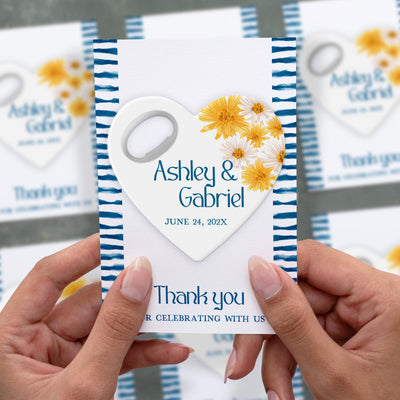 Heart Shaped Floral Detail wedding bottle opener magnet shown in hand on its printed background card