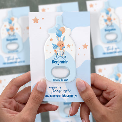 Blue Bunny baby shower bottle opener magnet shown in hand on its printed background card