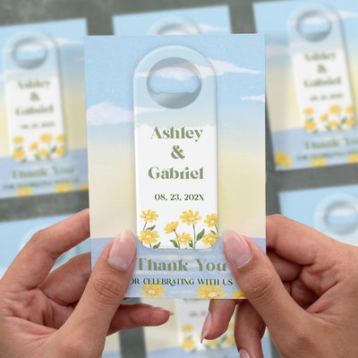 Modern Daisy wedding bottle opener magnet shown in hand on its printed background card