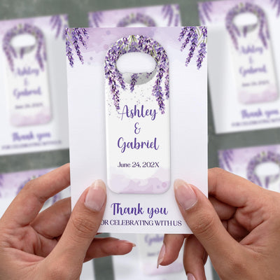Purple Wisteria wedding bottle opener magnet shown in hand on its printed background card