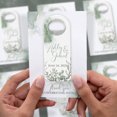 Sage Green Floral Elegant wedding bottle opener magnet shown in hand on its printed background card