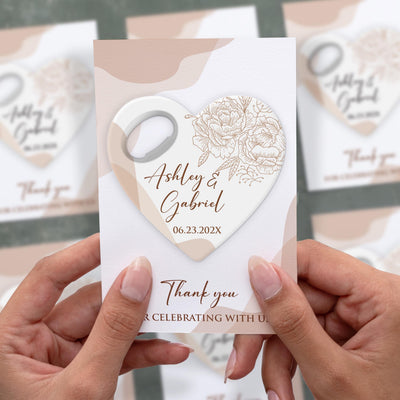 Engagement Minimalist Heart wedding bottle opener magnet shown in hand on its printed background card