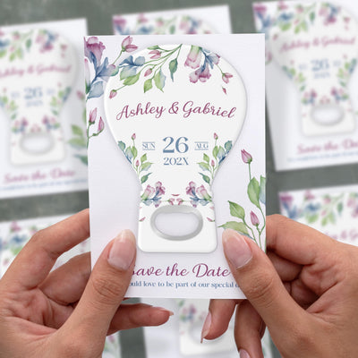 Floral Watercolor save the date bottle opener magnet shown in hand on its printed background card