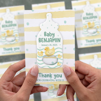 Woodland Moon baby shower bottle opener magnet shown in hand on its printed background card