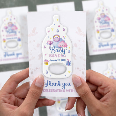 Pastel Celebration Icons baby shower bottle opener magnet shown in hand on its printed background card
