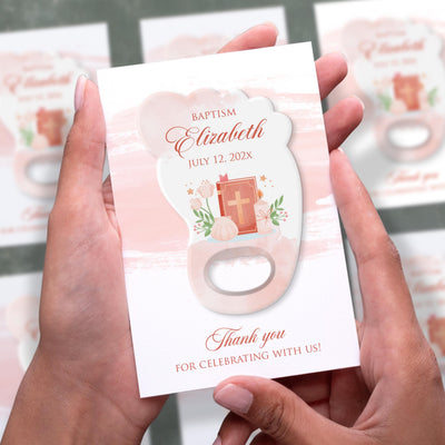 Pink Footprint Bible Candle Detail baptism bottle opener magnet shown in hand on its printed background card