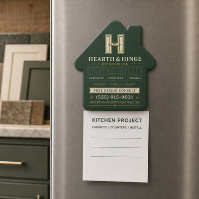 Kitchen Contractor custom logo bottle opener magnet - held on a refrigerator door by its magnetic back
