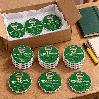 Landscaping Business custom logo bottle opener magnet - bulk order laid out before packing