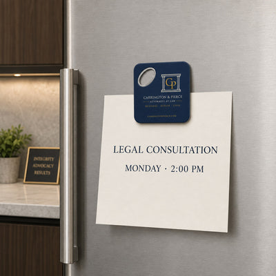 Law Firm custom logo bottle opener magnet - held on a refrigerator door by its magnetic back