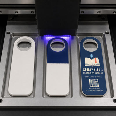 Library custom logo bottle opener magnet - close-up of the UV printed logo