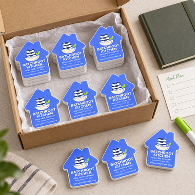 Meal Prep Company custom logo bottle opener magnet - bulk order laid out before packing