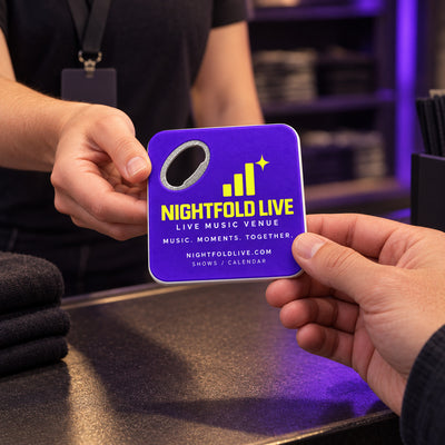 Music Venue custom logo bottle opener magnet - handed to a customer