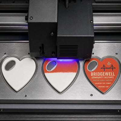 Nonprofit Organization custom logo bottle opener magnet - close-up of the UV printed logo