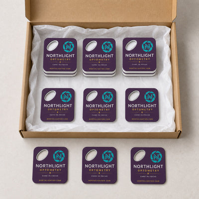 Optometry Practice custom logo bottle opener magnet - bulk order laid out before packing