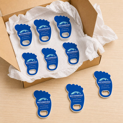 Physical Therapy Clinic custom logo bottle opener magnet - bulk order laid out before packing