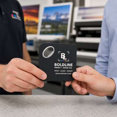 Print and Sign Shop custom logo bottle opener magnet - handed to a customer