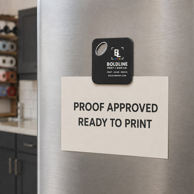 Print and Sign Shop custom logo bottle opener magnet - held on a refrigerator door by its magnetic back