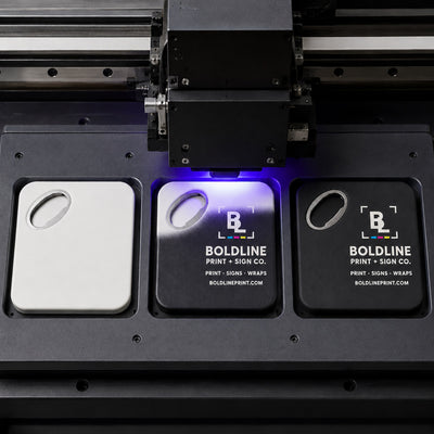 Print and Sign Shop custom logo bottle opener magnet - close-up of the UV printed logo