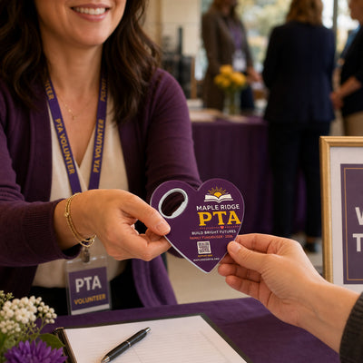 PTA Fundraiser custom logo bottle opener magnet - handed to a customer