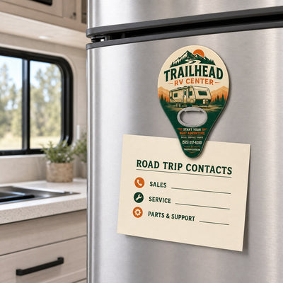 RV Dealer custom logo bottle opener magnet - held on a refrigerator door by its magnetic back